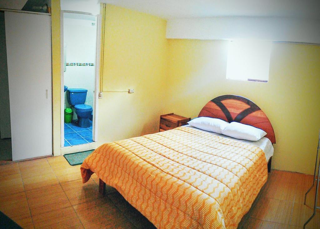 The Grasshopper Hostel Cusco Rum bild
